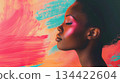 A thoughtful black woman is juxtaposed with vibrant, abstract brushstrokes, capturing a moment of serene contemplation. A thoughtful black woman is juxtaposed with vibrant, abstract brushstrokes, capturing a moment of serene contemplation. 134422604
