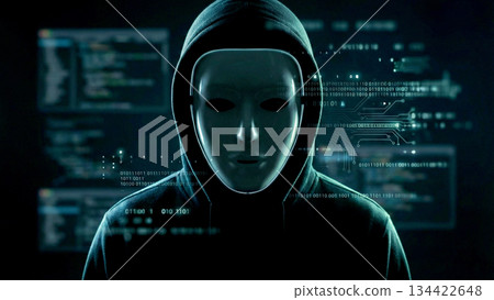 A hooded hacker types on a keyboard in a dark space, with warnings and code flashing on the screen. 134422648