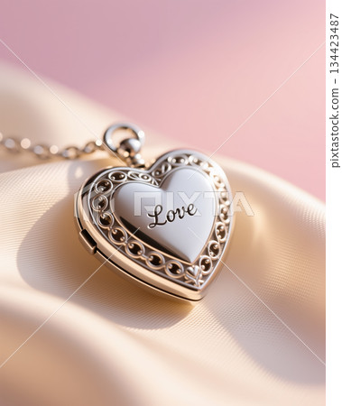 Heart locket with love engraving on white background. 134423487