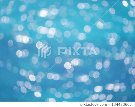 Defocused Blue Sea Water Background with Sunlight Bokeh Defocused Blue Sea Water Background with Sunlight Bokeh 134423603