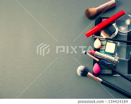 lots of makeup on a gray background 134424184