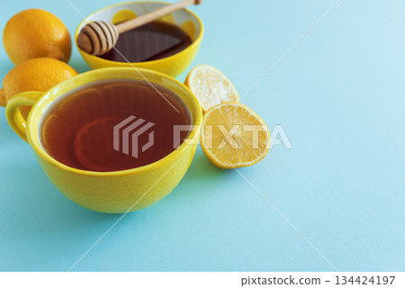 Flat Lay with Lemon Tea, Ginger and Honey on Blue Background 134424197