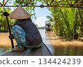 Local Woman Paddling Traditional Canoe Mekong Delta, Vietnam 134424239