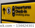 Departures Check In Elevator or Lift Sign at an Airport 134424301