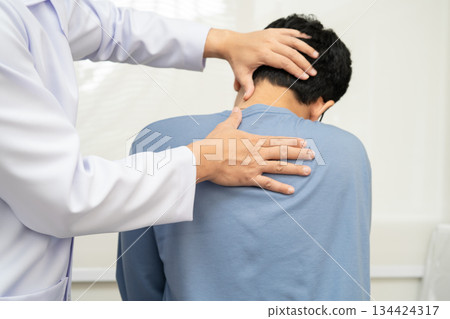Physical therapy, Asian therapist doctor treat perform pain young man in hospital. 134424317