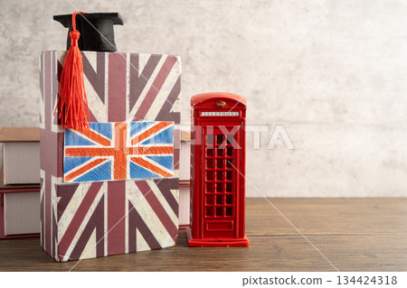 UK flag with graduate hat on english language book. 134424318