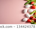 Easter, spring floral background. Red tulips and white eggs, flowers on pink background 134424378