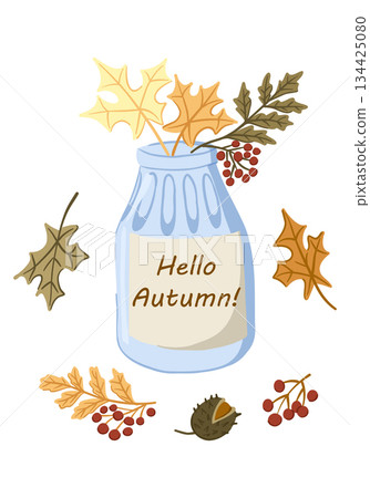 Glass jar with autumn leaves, berries and acorn arranged around with Hello Autumn text. Concept of fall season greeting, cozy natural composition and seasonal home decor 134425080