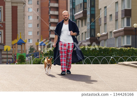 White man lazy morning dog walk White man lazy morning dog walk 134426166