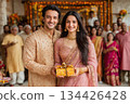 Couple celebrating festival with decorative gifts and joyful family gathering 134426428