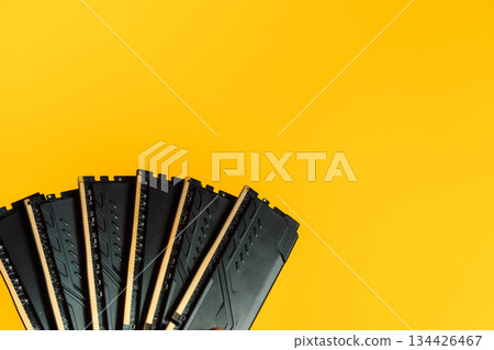 Fan arrangement of DDR RAM modules on yellow background with copy space 134426467