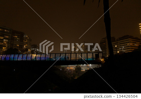 A bridge over a river with a city in the background. Miraflores, Lima. A bridge over a river with a city in the background. Miraflores, Lima. 134426504