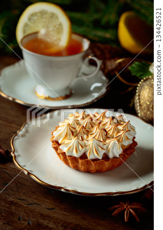 Meringue lemon tart and cup of tea. 134426521