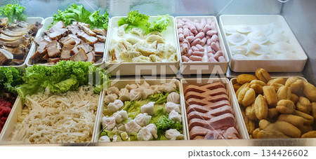 Fresh assorted ingredients displayed in trays for culinary preparation 134426602