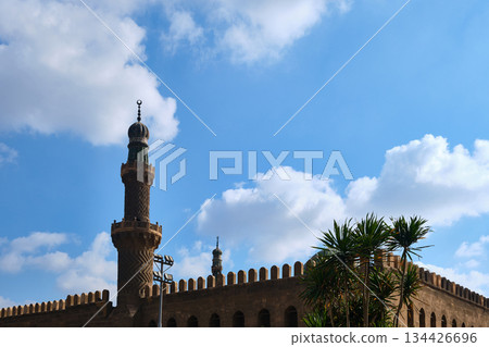 Historic Mosque Minaret Against Blue Sky Historic Mosque Minaret Against Blue Sky 134426696