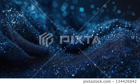 An abstract dark blue background with glowing particles and a soft bokeh effect creating a wavy pattern. A backdrop concept for banners, presentations, or luxury branding concepts. 134426842