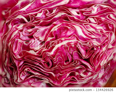 Close-up of vibrant purple cabbage showcasing intricate layered texture 134426926