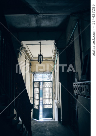 Narrow Historic Corridor with Light at the End 134427289