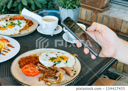 Smartphone displays nutrition tracking interface with macro breakdown. Nutrition tracking, calorie counter app, digital health, healthy lifestyle technology. 134427455