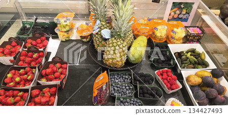 Berlin, Germany - September 19, 2025: Fresh assorted fruits displayed in market with vibrant colors and textures Berlin, Germany - September 19, 2025: Fresh assorted fruits displayed in market with vibrant colors and textures 134427493