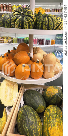Berlin, Germany - September 19, 2025: Colorful display of assorted pumpkins and squashes in grocery store Berlin, Germany - September 19, 2025: Colorful display of assorted pumpkins and squashes in grocery store 134427494