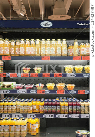 Berlin, Germany - September 20, 2025: Sanlucar juice display in supermarket with colorful bottles and labels Berlin, Germany - September 20, 2025: Sanlucar juice display in supermarket with colorful bottles and labels 134427497