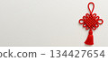 Chinese New Year decor with red knot on white background 134427654