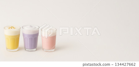 Three colorful beverages in glass cups on light background Three colorful beverages in glass cups on light background 134427662