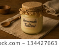 Jar of homemade tallow on rustic cloth in warm lighting, background Jar of homemade tallow on rustic cloth in warm lighting, background 134427663