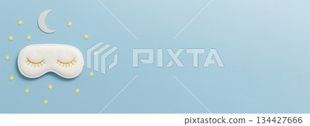 Sleep problem concept with eye mask, stars, and moon on light blue background Sleep problem concept with eye mask, stars, and moon on light blue background 134427666