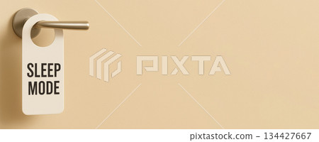 Sleep mode door hanger on beige background, health concept, copy space Sleep mode door hanger on beige background, health concept, copy space 134427667