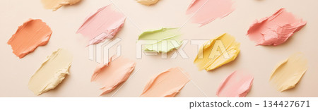 Fluid cosmetics textures featuring spread highlighter and foundation cream Fluid cosmetics textures featuring spread highlighter and foundation cream 134427671