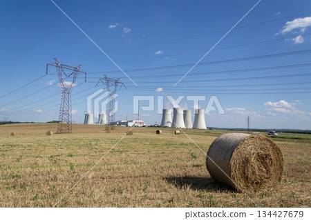 Cooling towers at nuclear power plant, energy self-sufficiency, greenhouse emission reduction and global warming concept 134427679