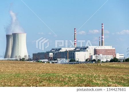 Cooling towers at nuclear power plant, energy self-sufficiency, greenhouse emission reduction and global warming concept Cooling towers at nuclear power plant, energy self-sufficiency, greenhouse emission reduction and global warming concept 134427681