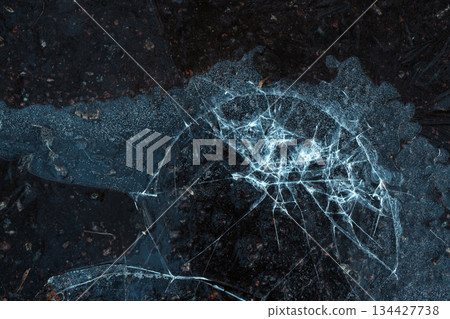 Frozen Abstract Pattern on Cracked Ice Surface Frozen Abstract Pattern on Cracked Ice Surface 134427738