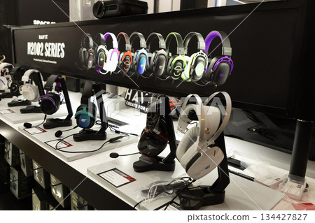 Berlin, Germany - September 09, 2025: Gaming headsets display at tech expo with vibrant colors 134427827