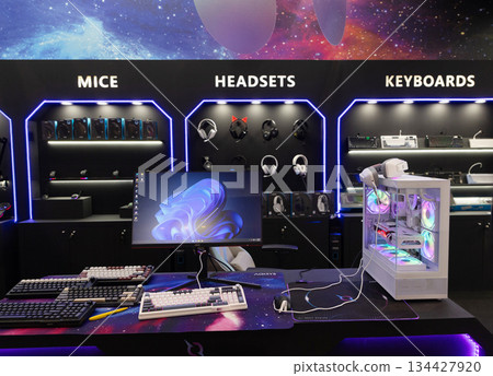 Berlin, Germany - September 09, 2025: Gaming accessories display with colorful lighting setup Berlin, Germany - September 09, 2025: Gaming accessories display with colorful lighting setup 134427920