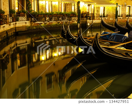 Landscape with Rialto Bridge and gondola Grand Canal in Venice, Italy, Europe. 134427951