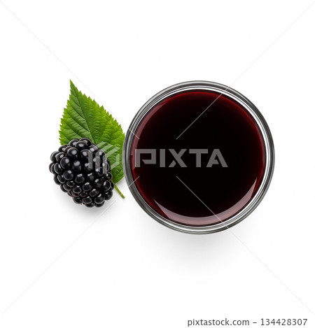 Homemade blackberry jam in a jar with fresh blackberries and green leaf on a white surface 134428307
