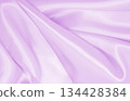 Smooth elegant lilac silk or satin texture as wedding background. Luxurious background design 134428384