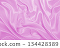 Smooth elegant pink silk or satin texture as wedding background. Luxurious background design 134428389