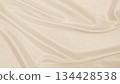 Smooth elegant golden silk or satin luxury cloth texture as wedding background. Luxurious background design. In Sepia toned. Retro style 134428538