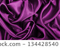 Smooth elegant pink silk or satin luxury cloth texture as abstract background. Luxurious background design 134428540