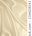 Smooth elegant golden silk or satin luxury cloth texture as wedding background. Luxurious background design. In Sepia toned. Retro style 134428541