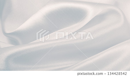 Smooth elegant grey silk or satin luxury cloth as wedding background. Luxurious background design 134428542