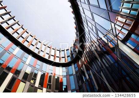 Brise soleil sun breakers on modern office building facade, global warming, sustainable living, future of work concept Brise soleil sun breakers on modern office building facade, global warming, sustainable living, future of work concept 134428655