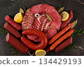 An assortment of various types of sausages, smoked meats, salami, and game sausages with lemon, spices, and herbs on a concrete table. Advertising and banner for a store, menu for a cafe or restaurant 134429193