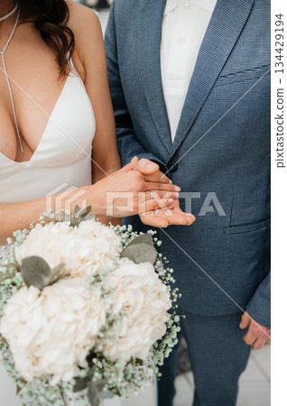 Couple shares tender promises, Closeup of partners exchanging heartfelt vows with kindness, Deeply affectionate exchange of promises during private wedding ceremony Couple shares tender promises, Closeup of partners exchanging heartfelt vows with kindness, Deeply affectionate exchange of promises during private wedding ceremony 134429194