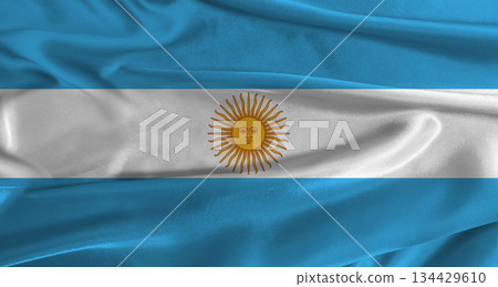 Flag of Argentina with fabric textured background. Close up of National flag of Argentina with realistic texture 134429610