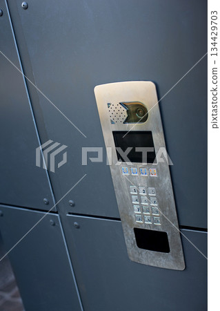 Surveillance and control at the building entrance Surveillance and control at the building entrance 134429703